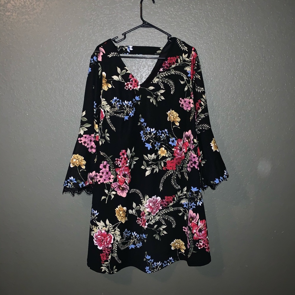 Knee length dress. Black with flowers.
